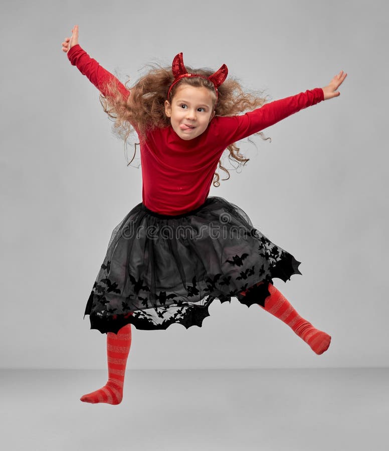 Girl in Halloween Costume of Devil Jumping Stock Image - Image of happy ...