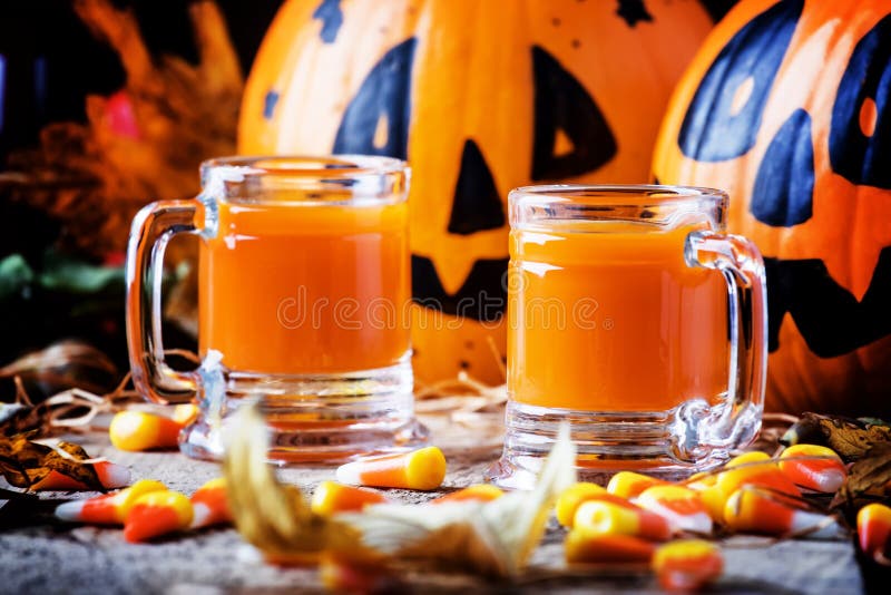 Halloween orange cocktail on a dark festive autumn background, s