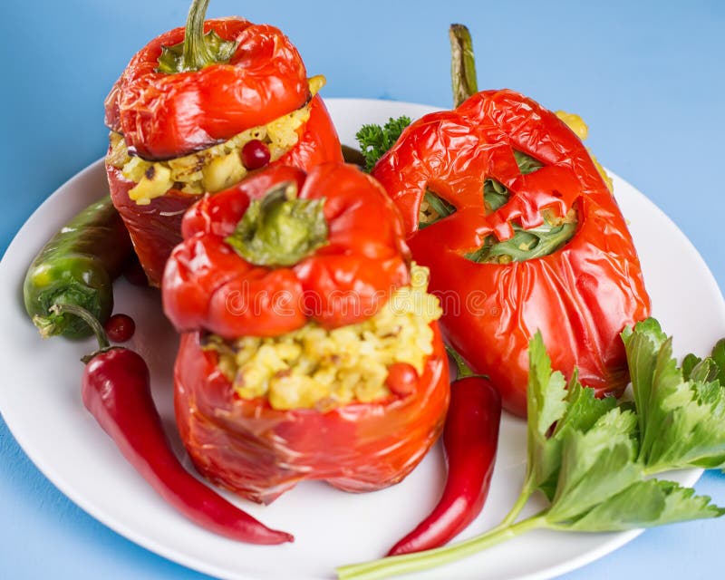 Halloween party food. Red stuffed peppers with scary cutout faces close up royalty free stock photography Halloween party food. Red stuffed peppers with scary cutout faces close up royalty free stock photography