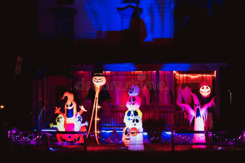 Halloween porch decorations celebrating the spooky season with ghosts, goblins, and a graveyard