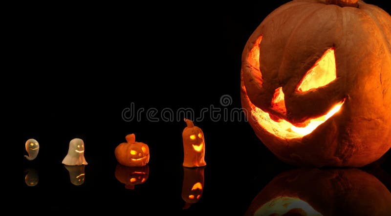 Halloween pumpkin with burning candles on black background royalty free stock images Halloween pumpkin with burning candles on black background royalty free stock images