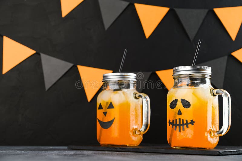 https://thumbs.dreamstime.com/b/halloween-pumpkin-iced-mocktails-glass-jars-decorated-scary-faces-dark-table-diy-party-decoration-black-wall-196368643.jpg