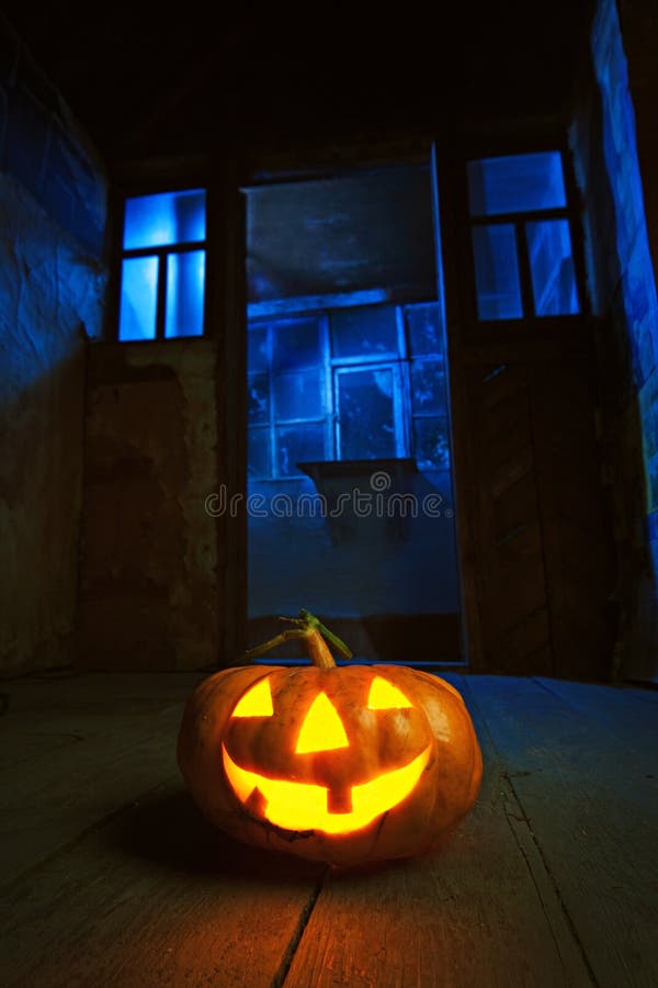 Halloween pumpkin in night on old wood room