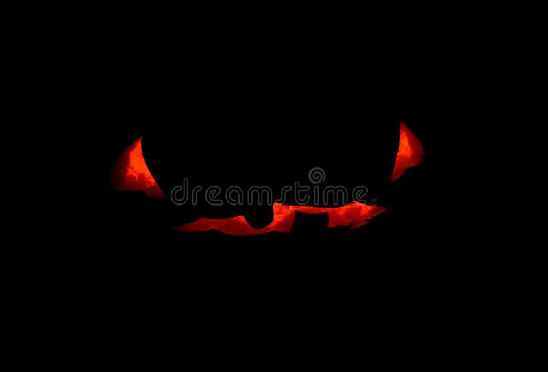 Halloween pumpkin scary face with candle inside, concept photo on black background. Pumpkin face glowing silhouette. royalty free stock images Halloween pumpkin scary face with candle inside, concept photo on black background. Pumpkin face glowing silhouette. royalty free stock images