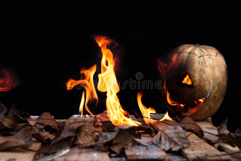 Halloween Pumpkin Spewing Flames Of Fire On A Black Background Stock