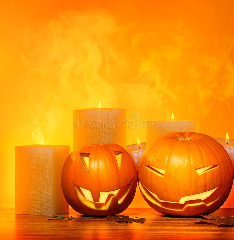 Halloween pumpkins holiday border, with candles and smoke, traditional jack-o-lantern over warm yellow light, night party decoration, fun concept. Halloween pumpkins holiday border, with candles and smoke, traditional jack-o-lantern over warm yellow light, night party decoration, fun concept