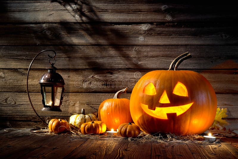 Halloween pumpkin head jack lantern on wooden background. Halloween pumpkin head jack lantern on wooden background