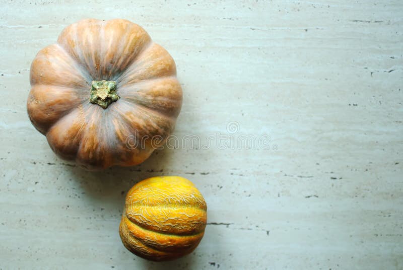 Halloween punpkin and melons background with copy space. Selective focus and bokeh. stock images Halloween punpkin and melons background with copy space. Selective focus and bokeh. stock images