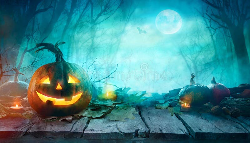 Halloween Pumpkins on wood. Halloween Background At Night Forest with Moon. Halloween Pumpkins on wood. Halloween Background At Night Forest with Moon.