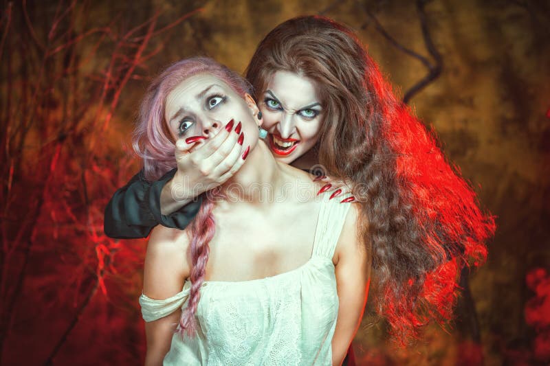 Halloween vampire and her victim