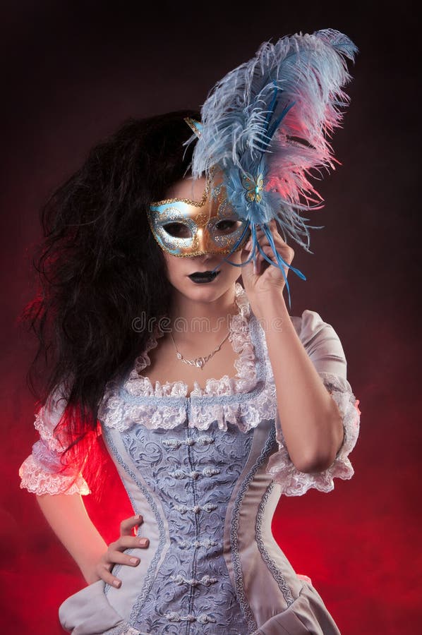 Halloween vampire woman with venetian mask