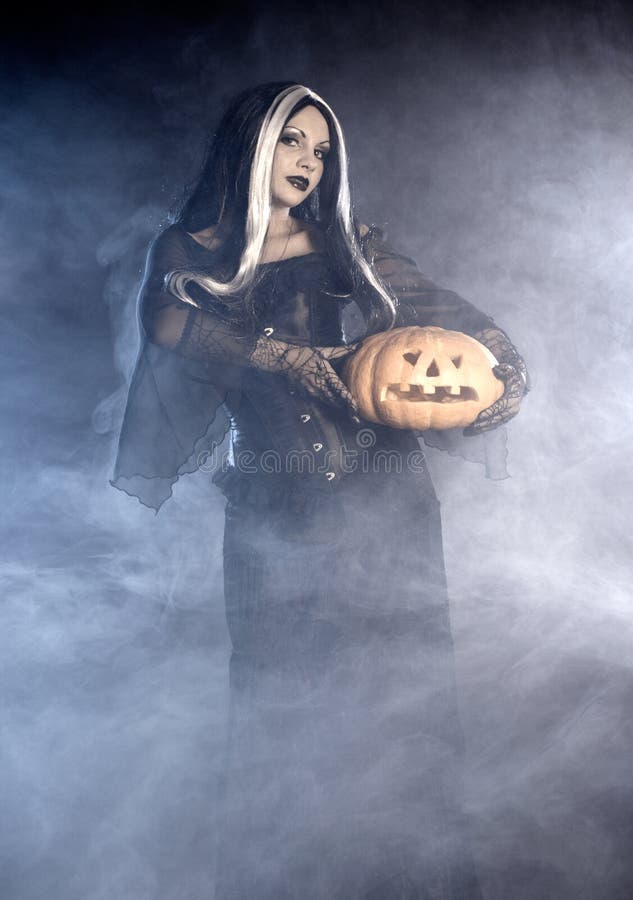 Halloween Witch with a Skull Stock Image - Image of person, lady: 16589865