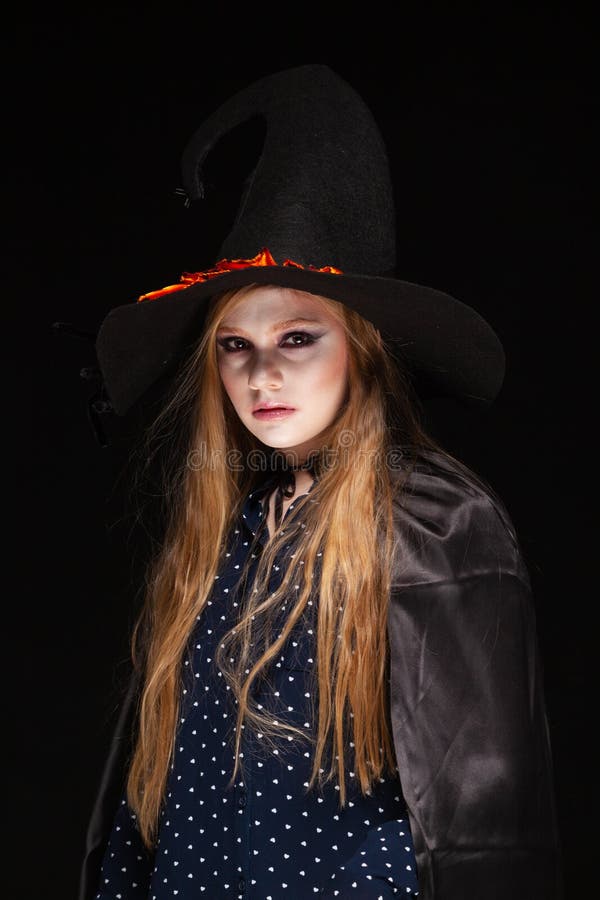 Halloween. Witch With A Spider On His Hat On Black Background ...