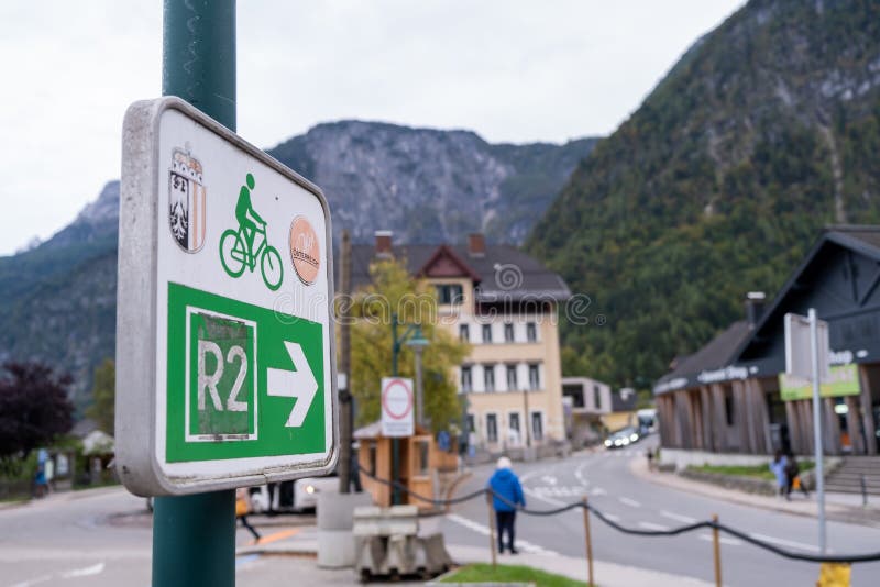 Hallstatt, Austria - October 6, 2019: View of bicycle lane sign at Hallstatt village on Hallstatter See Lake in High Alps Mountains, a  famous romantic European travel lakeside destination, Austria