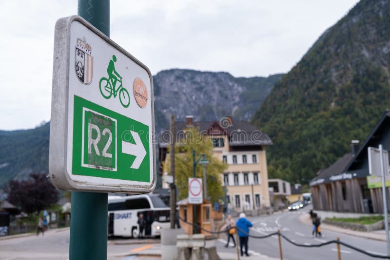 Hallstatt, Austria - October 6, 2019: View of bicycle lane sign at Hallstatt village on Hallstatter See Lake in High Alps Mountains, a  famous romantic European travel lakeside destination, Austria