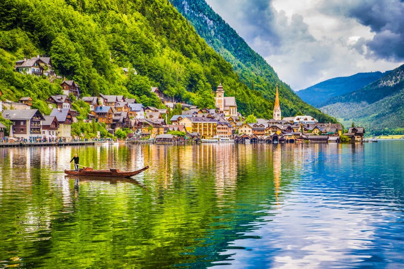 Hallstatt with traditional PlÃ¤tte boat, Salzkammergut, Austria