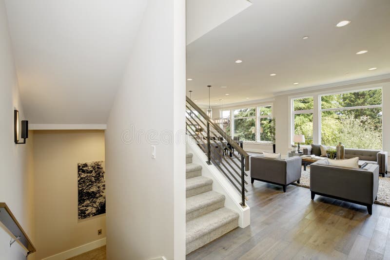 Hallway features white ceiling dotted with pot lighting stock image