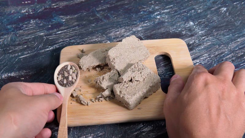 Sunflower halva. Halva pieces on a wooden board. Oriental sweets