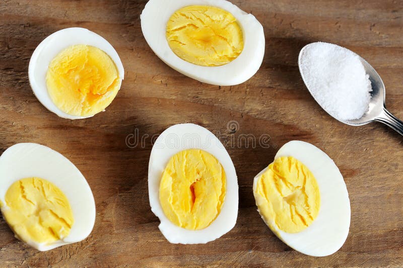 Halves of Boiled Egg and Salt in a Teaspoon Stock Image Image of