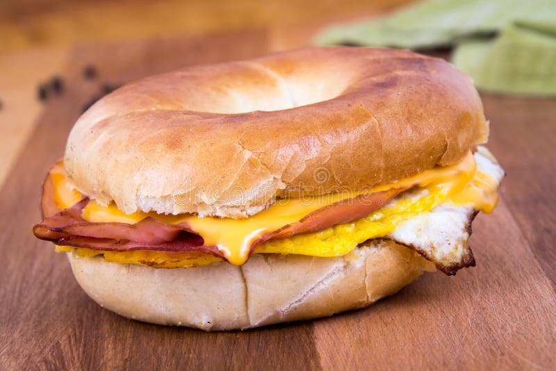 Ham, Egg and Cheese Breakfast Sandwich on a Bagel Stock Image - Image