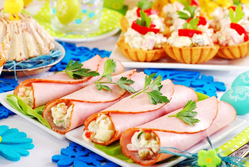 Ham rolls stuffed with vegetable salad and mayonnaise