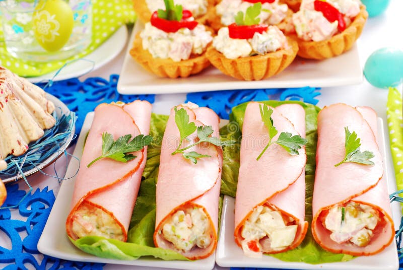 Ham rolls stuffed with vegetable salad and mayonnaise