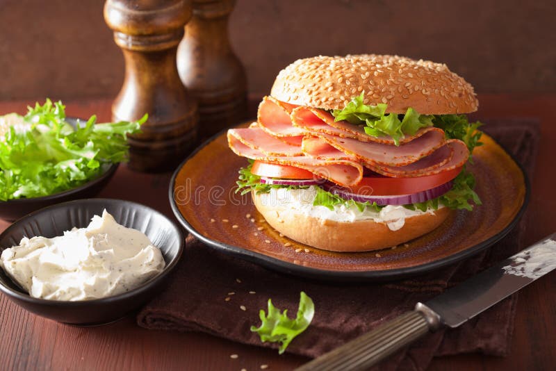 Ham Sandwich on Bagel with Cream Cheese Tomato Onion Stock Image