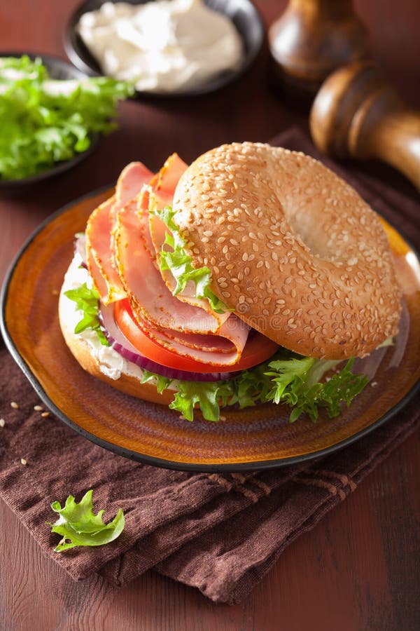 Ham Sandwich on Bagel with Cream Cheese Tomato Onion Stock Photo