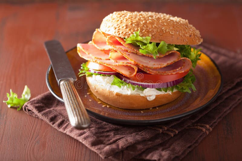 Ham Sandwich on Bagel with Cream Cheese Tomato Onion Stock Image