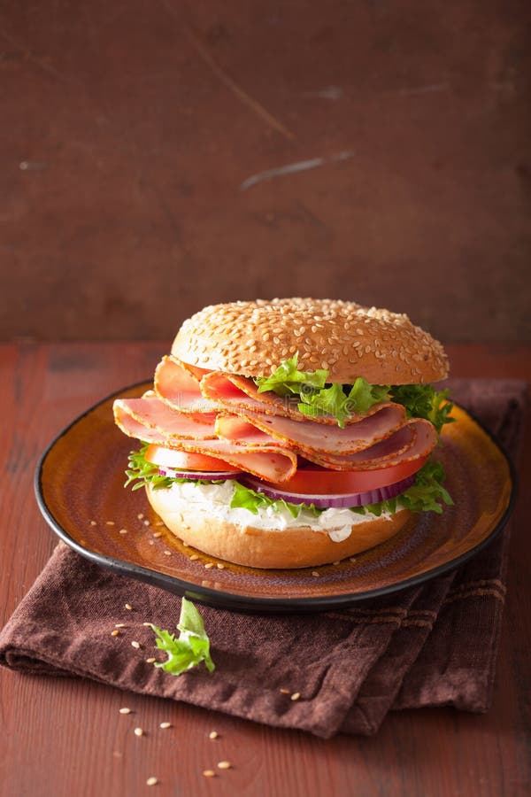Ham Sandwich on Bagel with Cream Cheese Tomato Onion Stock Photo