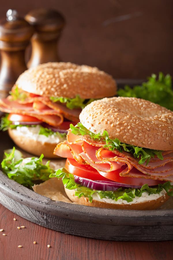 Ham Sandwich on Bagel with Cream Cheese Tomato Onion Stock Image