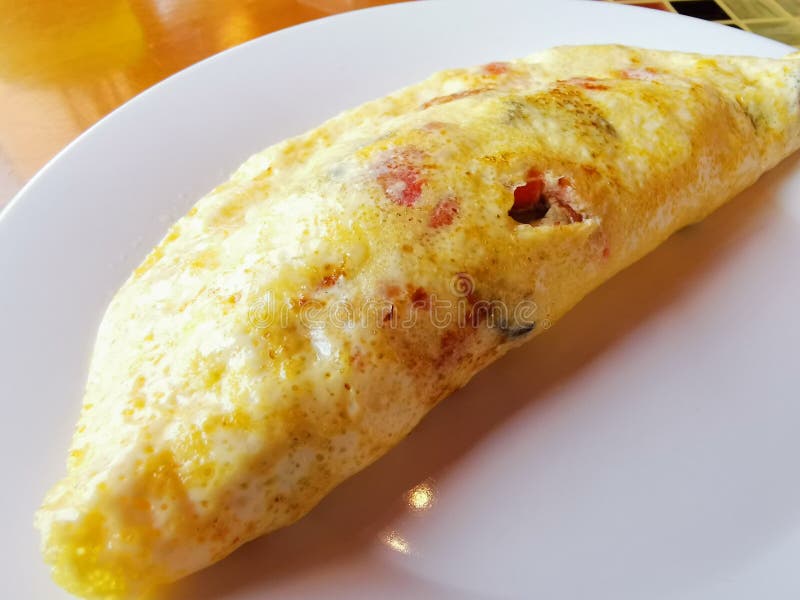 Ham, Vegetables and Cheese Egg Omelette on a Plate Stock Photo Image
