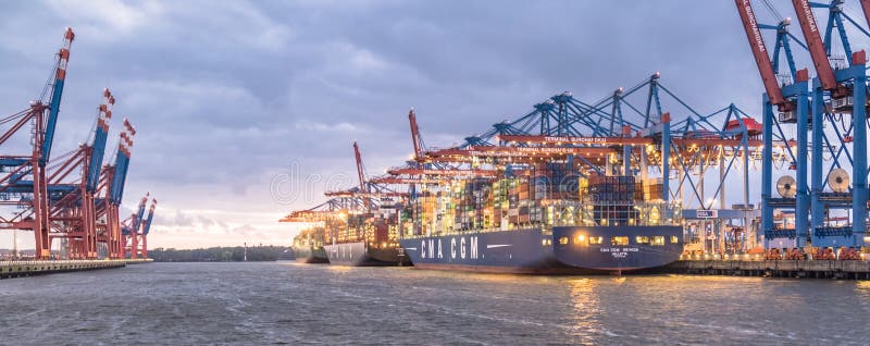 Hamburg , Germany - July 12 2017: Container gantry cranes of the terminal Burchardkai unloading ships in the deepwater stock images Hamburg , Germany - July 12 2017: Container gantry cranes of the terminal Burchardkai unloading ships in the deepwater stock images