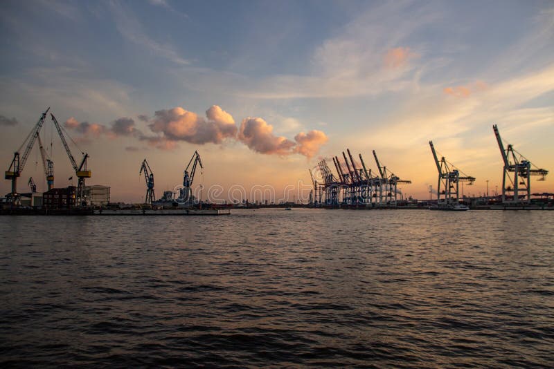 Cranes at Hamburg Harbour at Sunset