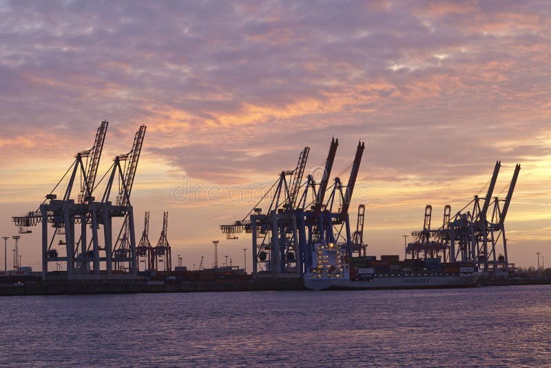 Hamburg - Port at sunset with container gantry cranes