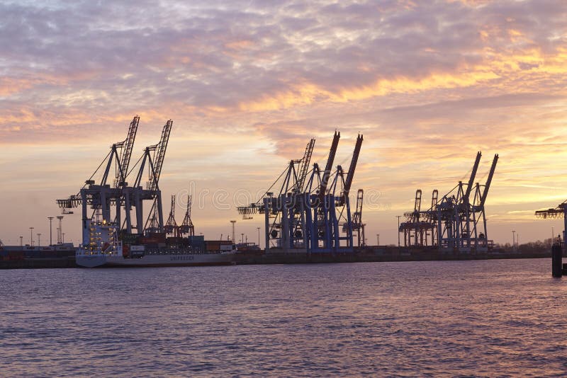 Hamburg - Port at sunset with container gantry cranes