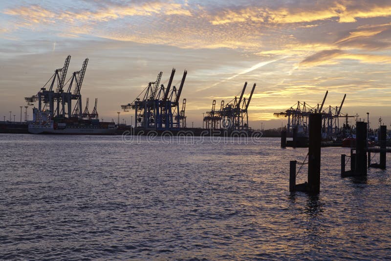 Hamburg - Port at sunset with container gantry cranes