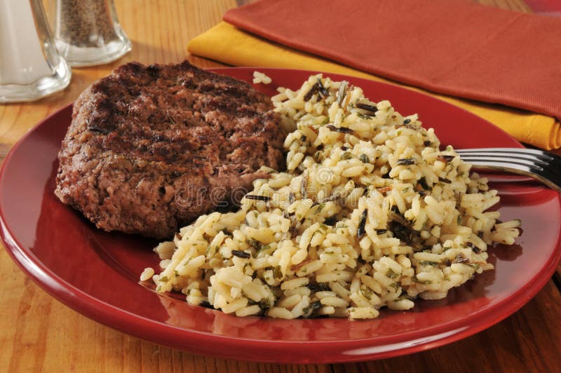 A grlled ground sirloin patty with long grain and wild rice. A grlled ground sirloin patty with long grain and wild rice