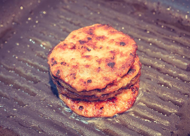 Hamburgers in a grill pan stock image. Image of delicious 55669359