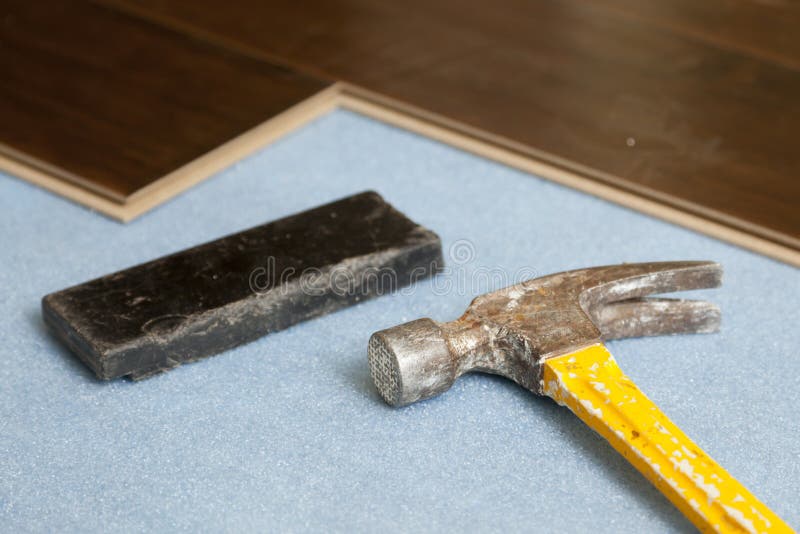 Hammer and Block with New Laminate Flooring Stock Photo Image of