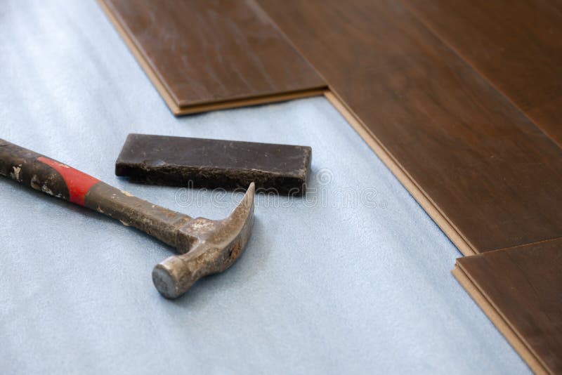 Hammer, Laminate Flooring and New Baseboard Molding Stock Image Image