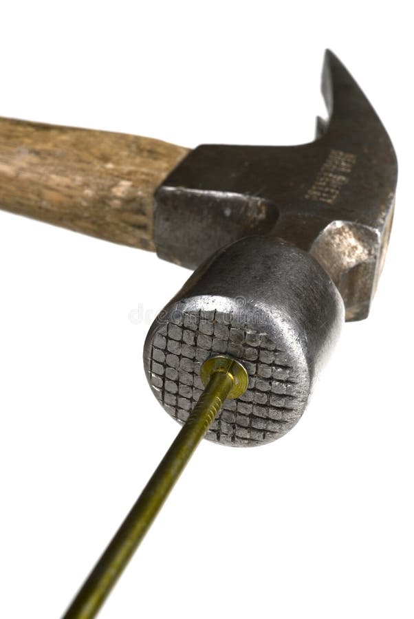Closeup image of a nail being hammered. Closeup image of a nail being hammered.