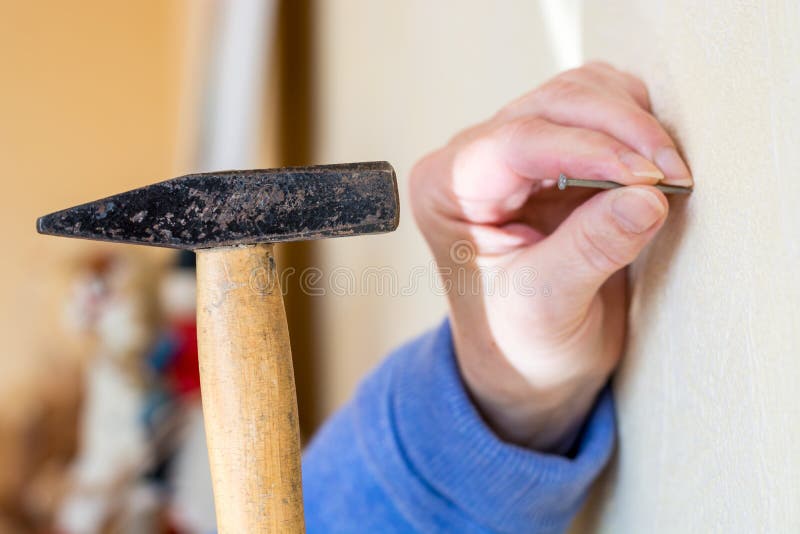 Hammer a Nail into a Wall Close Up Stock Image - Image of equipment,  concept: 100063313