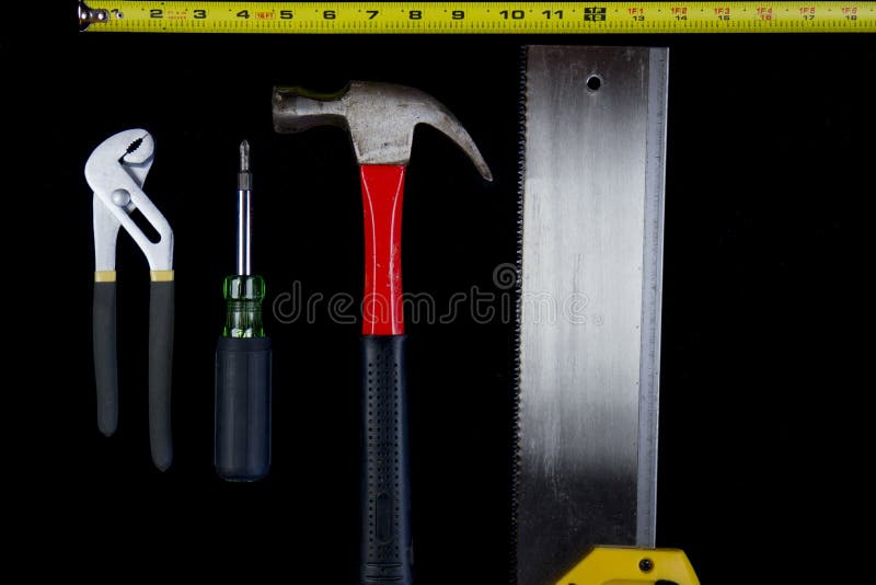 Hammer Screwdriver Measuring Tape Channel Locks and Saw Stock Image
