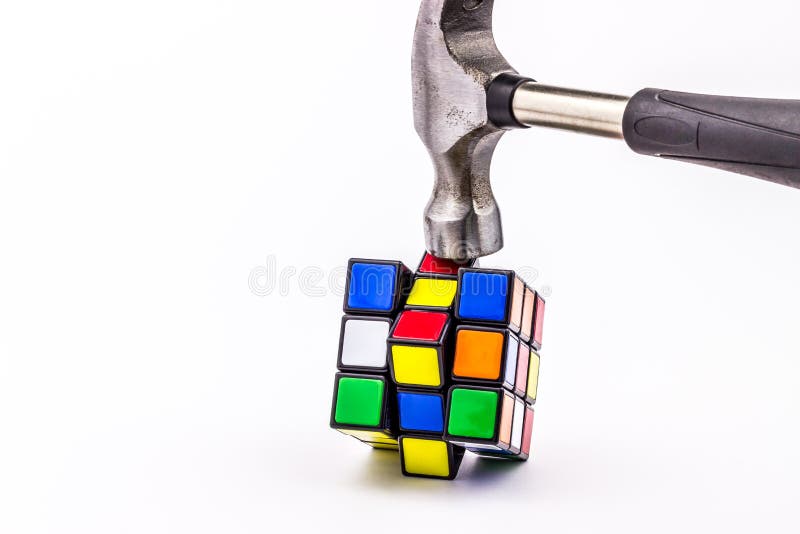 Hammer smashing Rubik cube