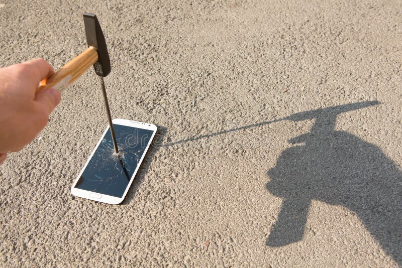 Hammer Smashing the Screen of a Smartphone Stock Photo Image of