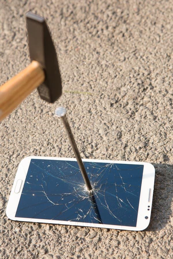 Hammer Smashing the Screen of a Smartphone Stock Photo Image of