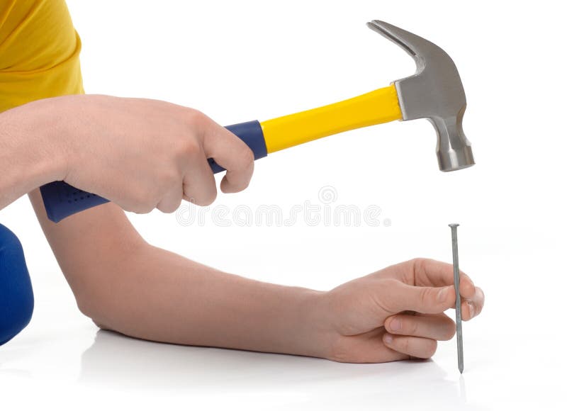 Hammering a nail stock image. Image of hammer, helmet 13093579