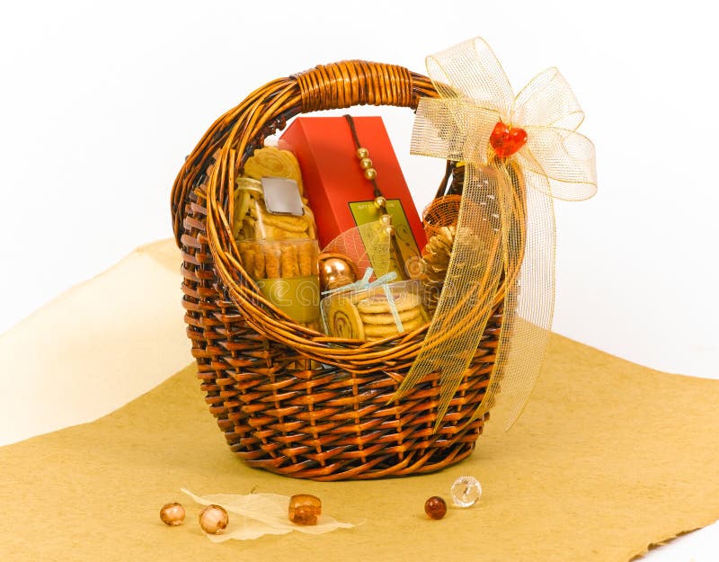 Hamper basket with cookies and chocolates box decorate by ribbon. Hamper basket with cookies and chocolates box decorate by ribbon