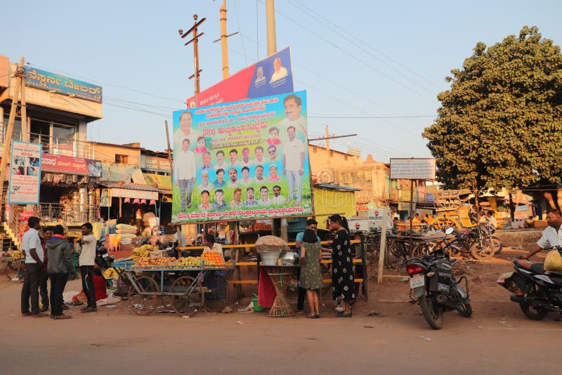 Tourists visiting Hampi Bazaar, a quaint marketplace in Hampi, Karnataka - India tourism